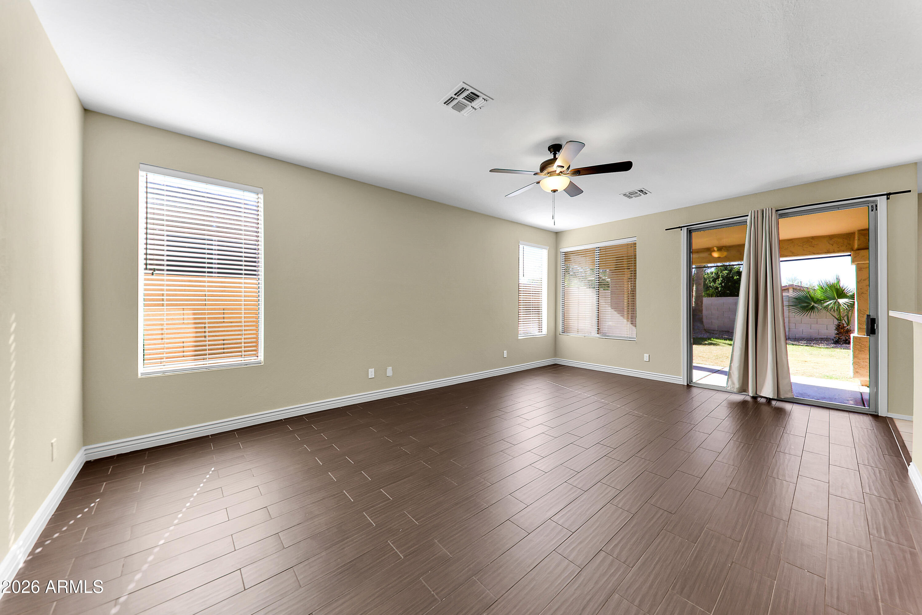 1819 West Nighthawk Way Phoenix, AZ 85045 - Photo 6 of 25 wooden floor in an empty room with a window