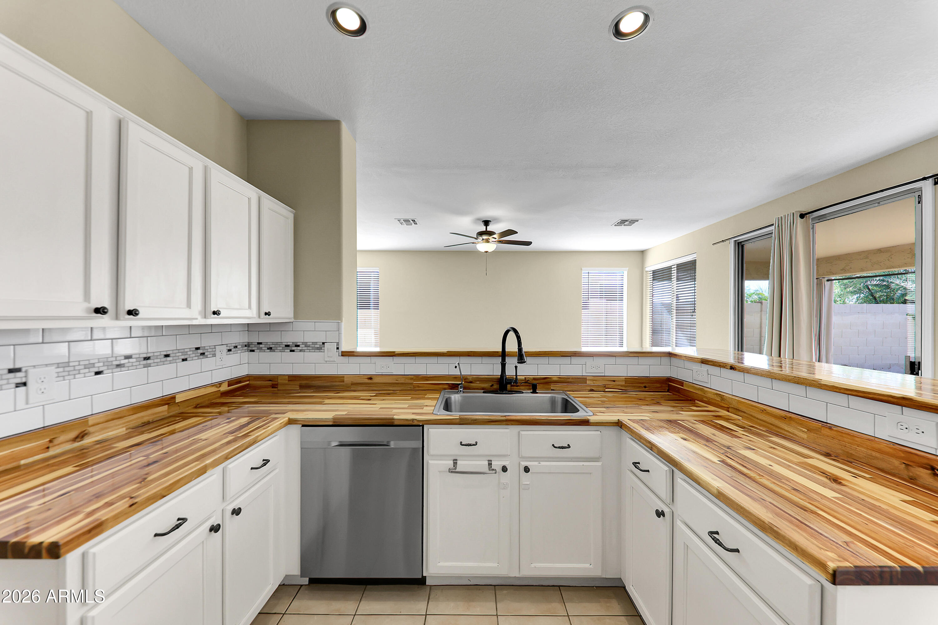 1819 West Nighthawk Way Phoenix, AZ 85045 - Photo 8 of 25 a kitchen that has a sink and a stove