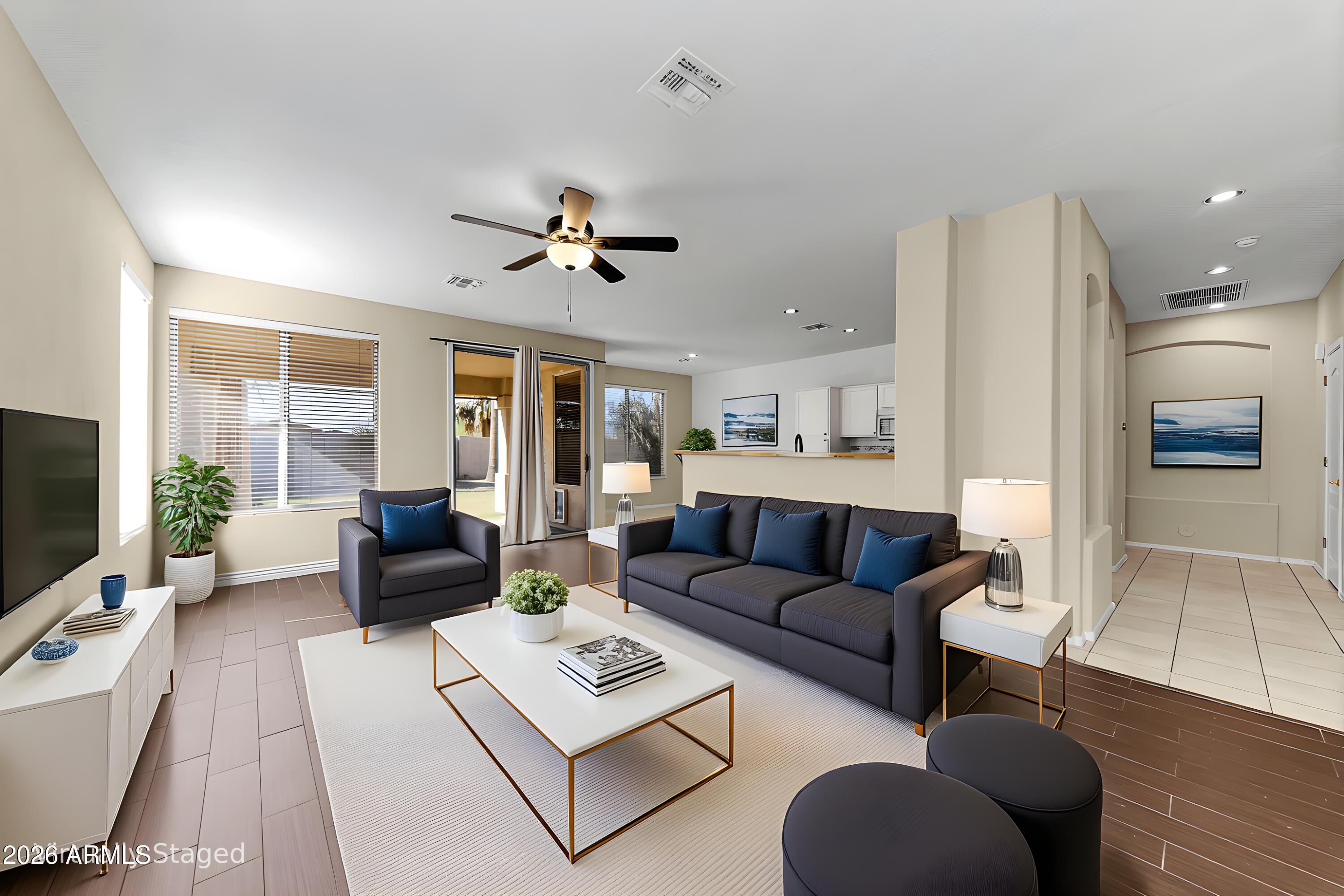 1819 West Nighthawk Way Phoenix, AZ 85045 - Photo 9 of 25 a living room with furniture and a flat screen tv