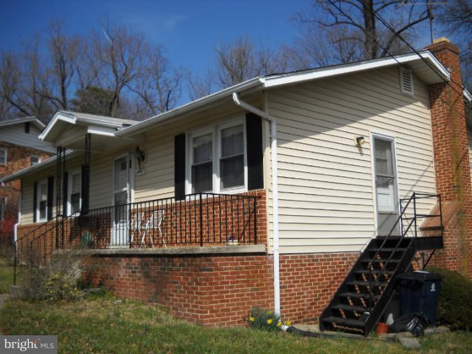 4505 Kinmount Road Lanham, MD 20706 - Photo 1 of 4 a front view of a house with a yard
