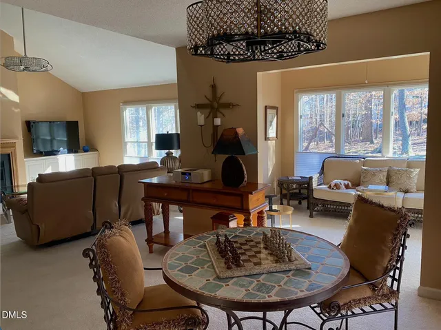 a bedroom with a large bed and a dresser