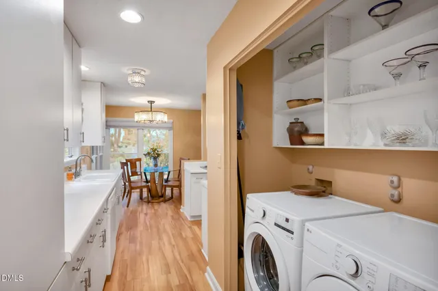 a front view of a house with a yard and seating space