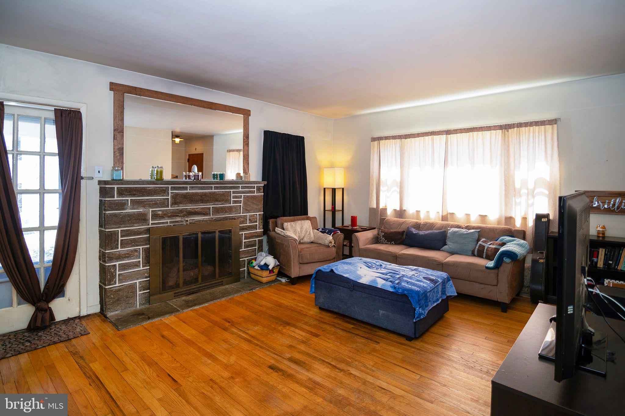 13 Cedarbrook Road Sicklerville, NJ 08081 - Photo 7 of 38 Living Room: Hardwood and Stone Fireplace