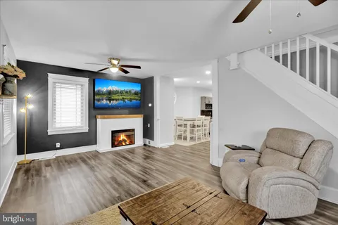 a bedroom with a bed and large window