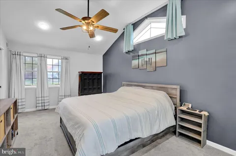 a kitchen with granite countertop a sink and a wooden floor