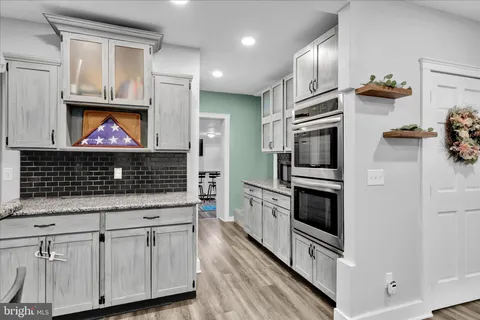 a view of room with window and wooden floor