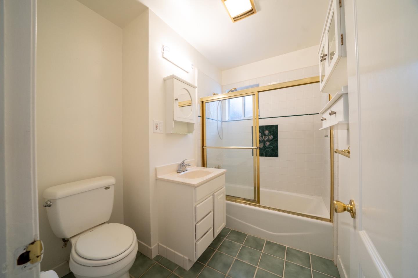 616 Brighton Road Pacifica, CA 94044 - Photo 13 of 14 a bathroom with a toilet sink and shower