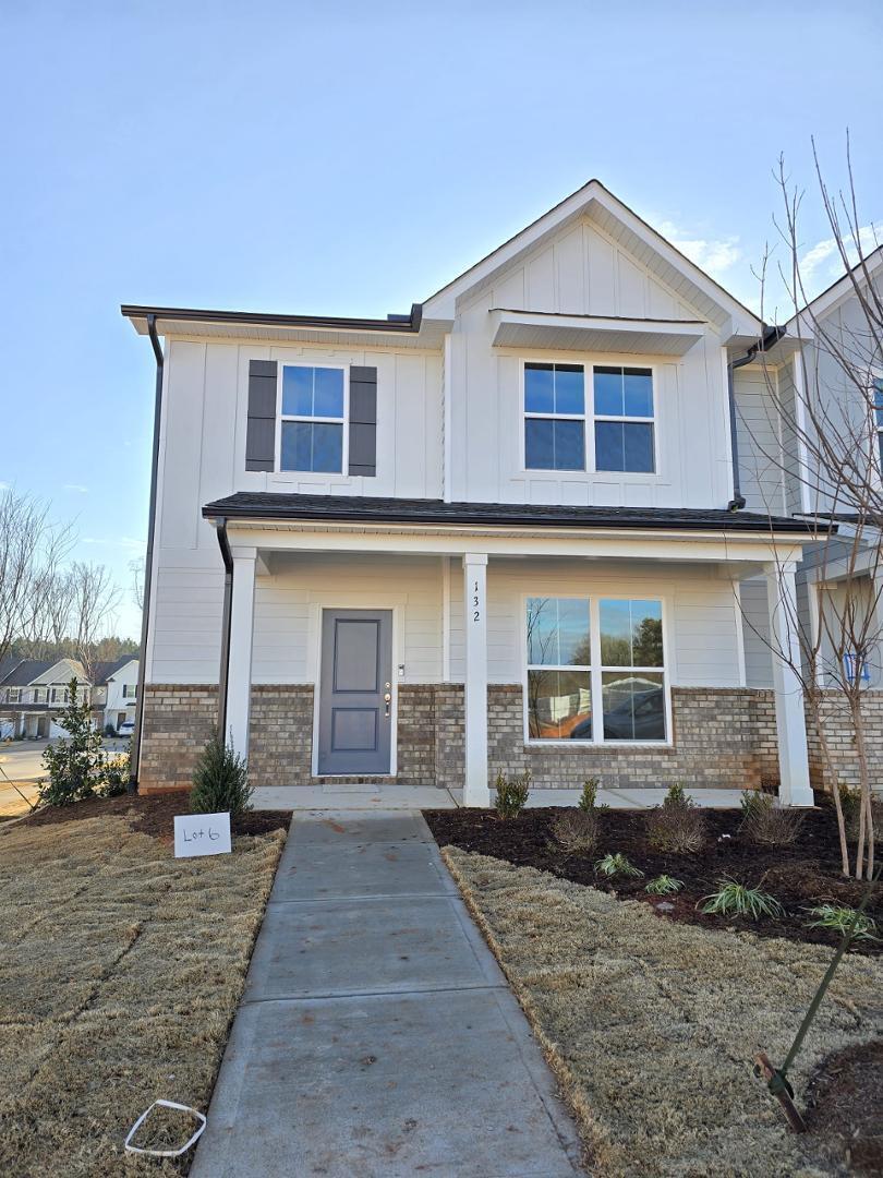 132 Abbots Ml Drive Raleigh, NC 27603 - Photo 1 of 2 a front view of a house with a yard and garage