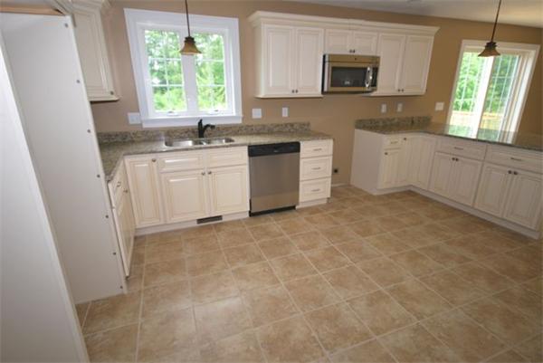 294 Maple Avenue Rutland, MA 01543 - Photo 5 of 27 a kitchen with a sink window and cabinets
