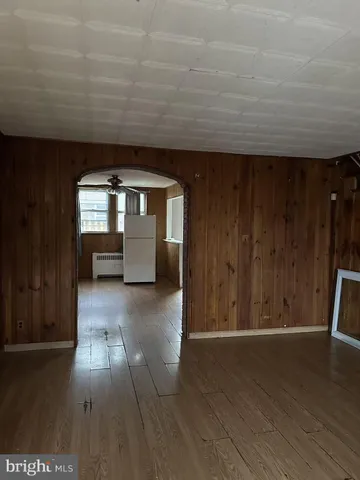 a view of gallery with wooden floor