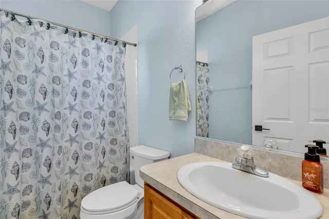 a bedroom with two beds and a window