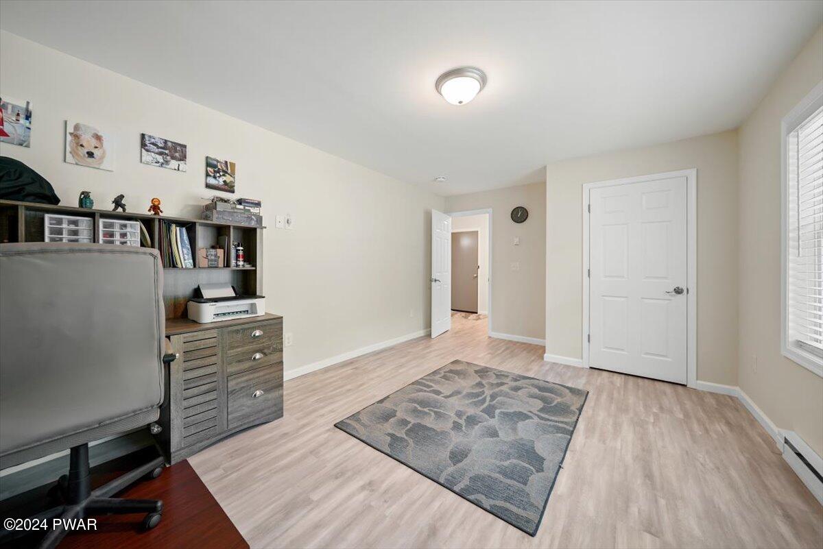 133 Butternut Road Milford, PA 18337 - Photo 20 of 34 a view of a bedroom with furniture and wooden floor