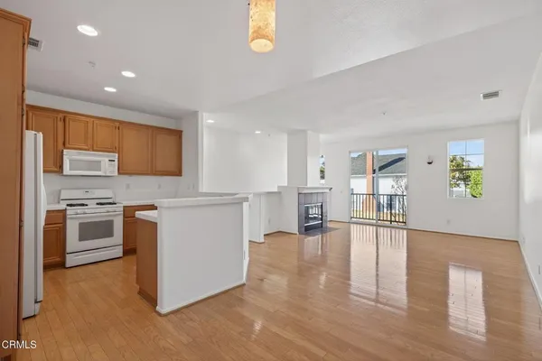 a view of kitchen with wooden floor
