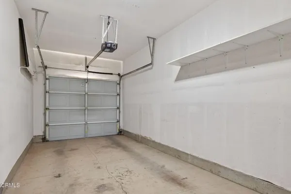 a front view of a house with garage
