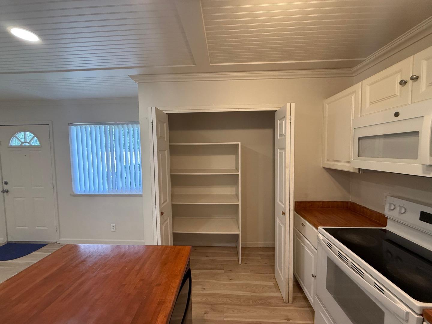 2505 Prescott Road, Unit 1 Modesto, CA 95350 - Photo 23 of 42 a kitchen with granite countertop white cabinets and appliances