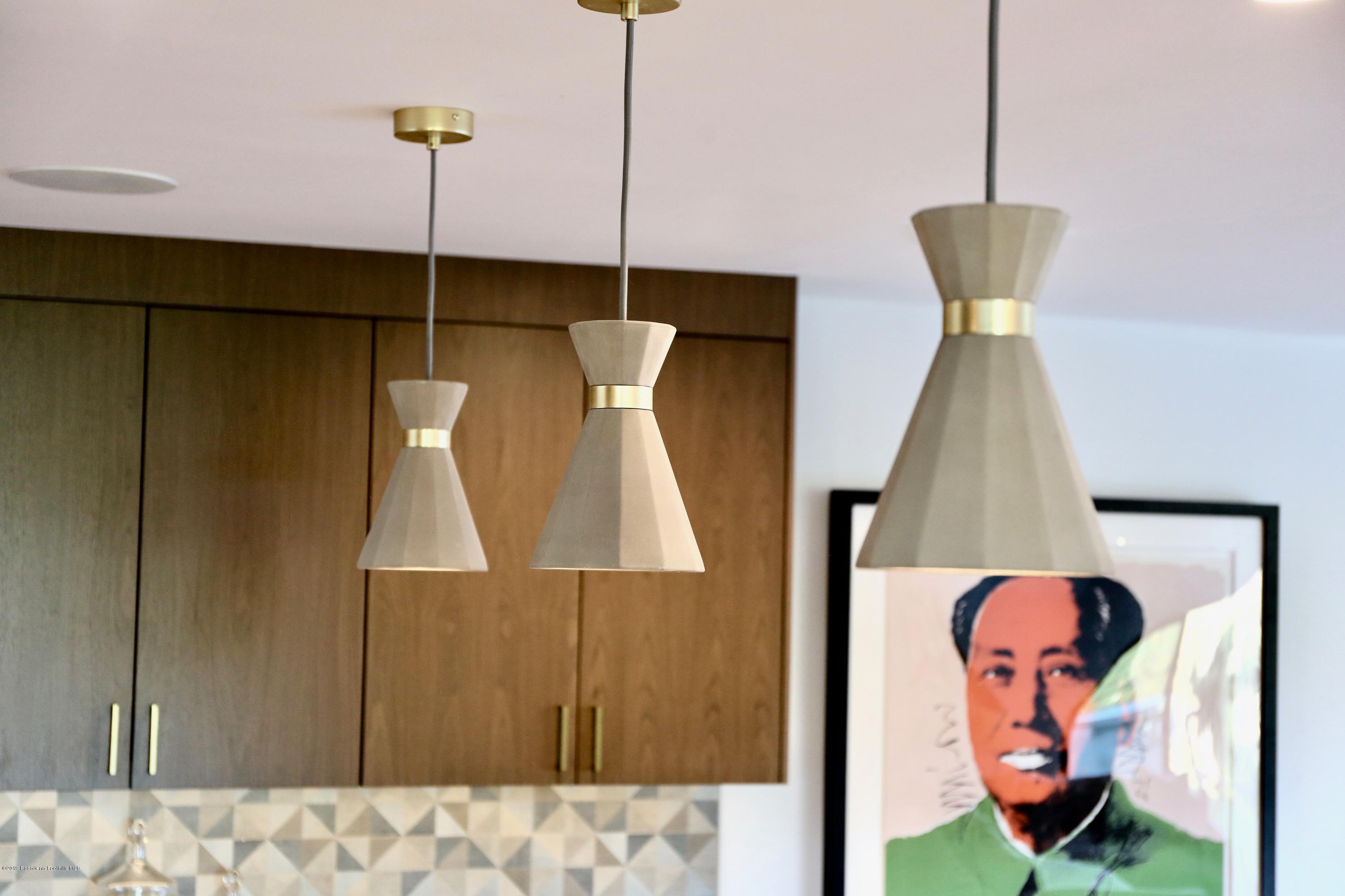 250 La Mirada Road Pasadena, CA 91105 - Photo 14 of 42 a bathroom with a sink and mirror