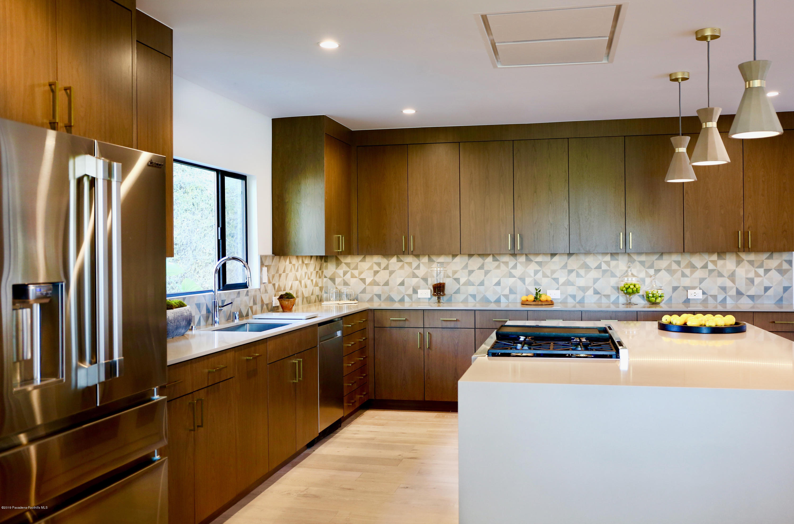250 La Mirada Road Pasadena, CA 91105 - Photo 15 of 42 a kitchen that has a sink and a stove in it