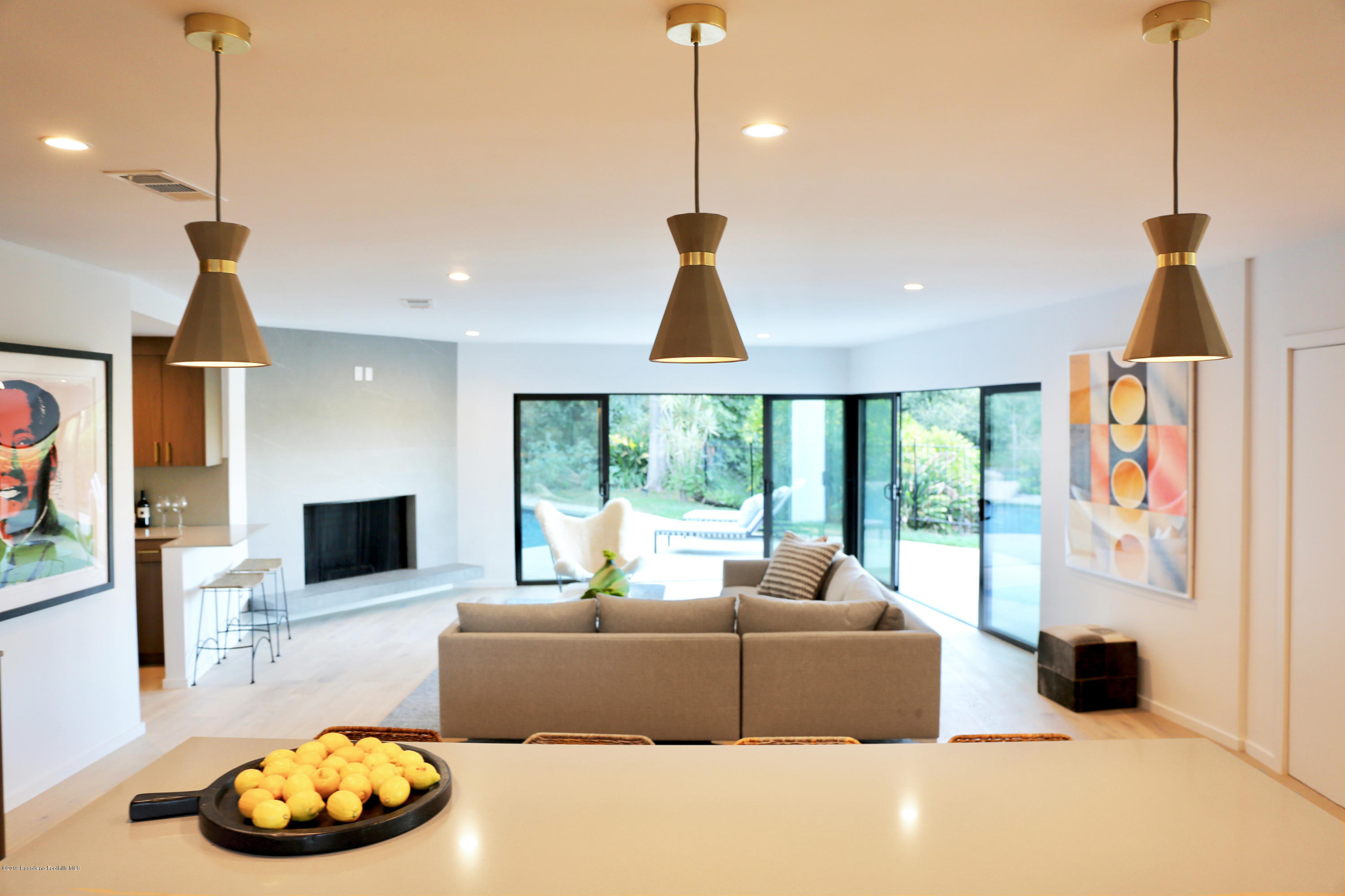 250 La Mirada Road Pasadena, CA 91105 - Photo 16 of 42 a living room with furniture and a flat screen tv