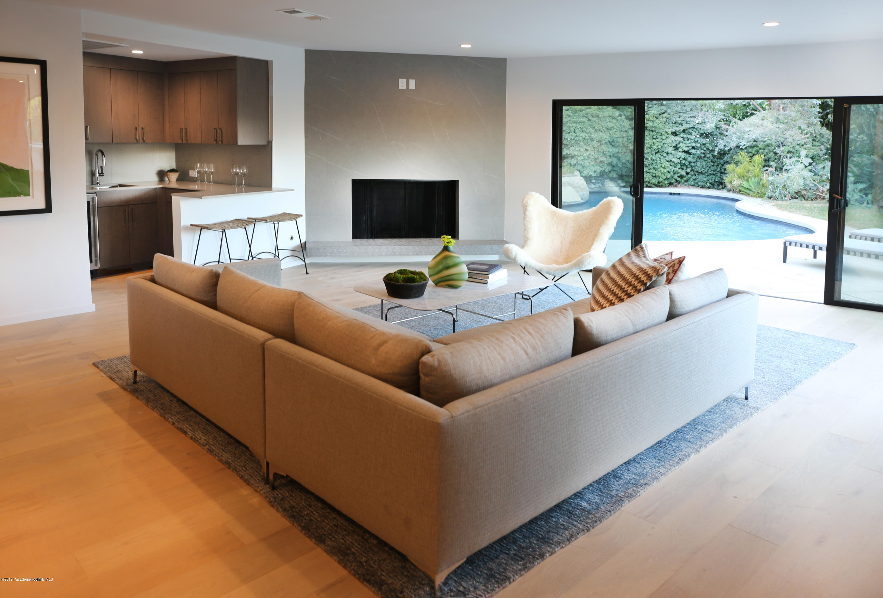 250 La Mirada Road Pasadena, CA 91105 - Photo 18 of 42 a living room with furniture and a large window