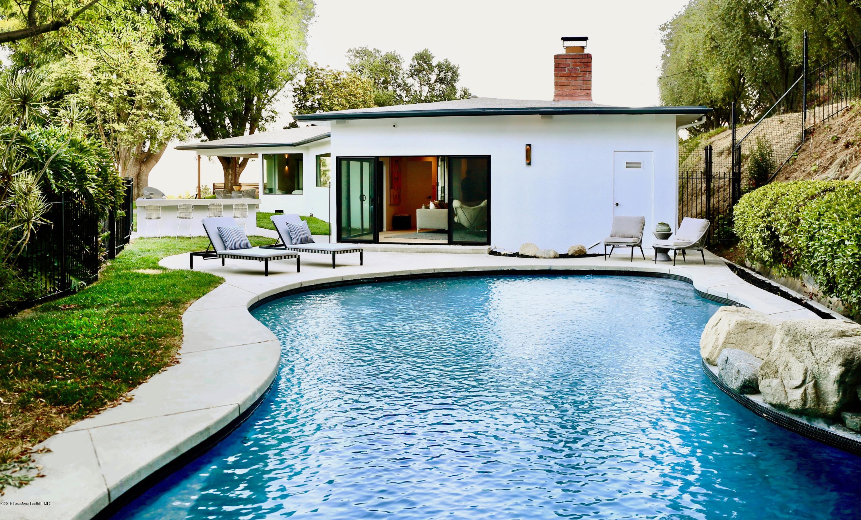 250 La Mirada Road Pasadena, CA 91105 - Photo 20 of 42 a view of swimming pool with outdoor seating