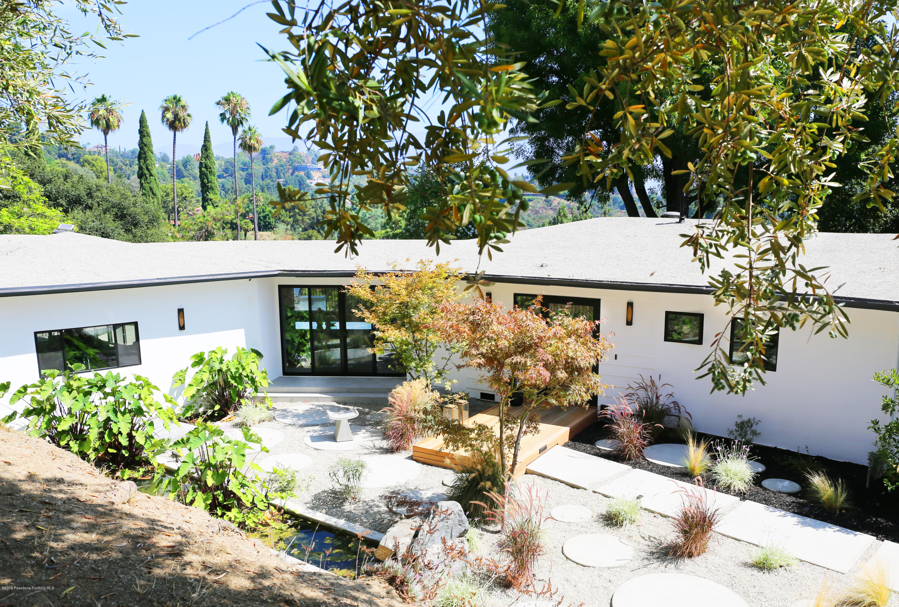 250 La Mirada Road Pasadena, CA 91105 - Photo 3 of 42 a view of a house with yard and sitting area
