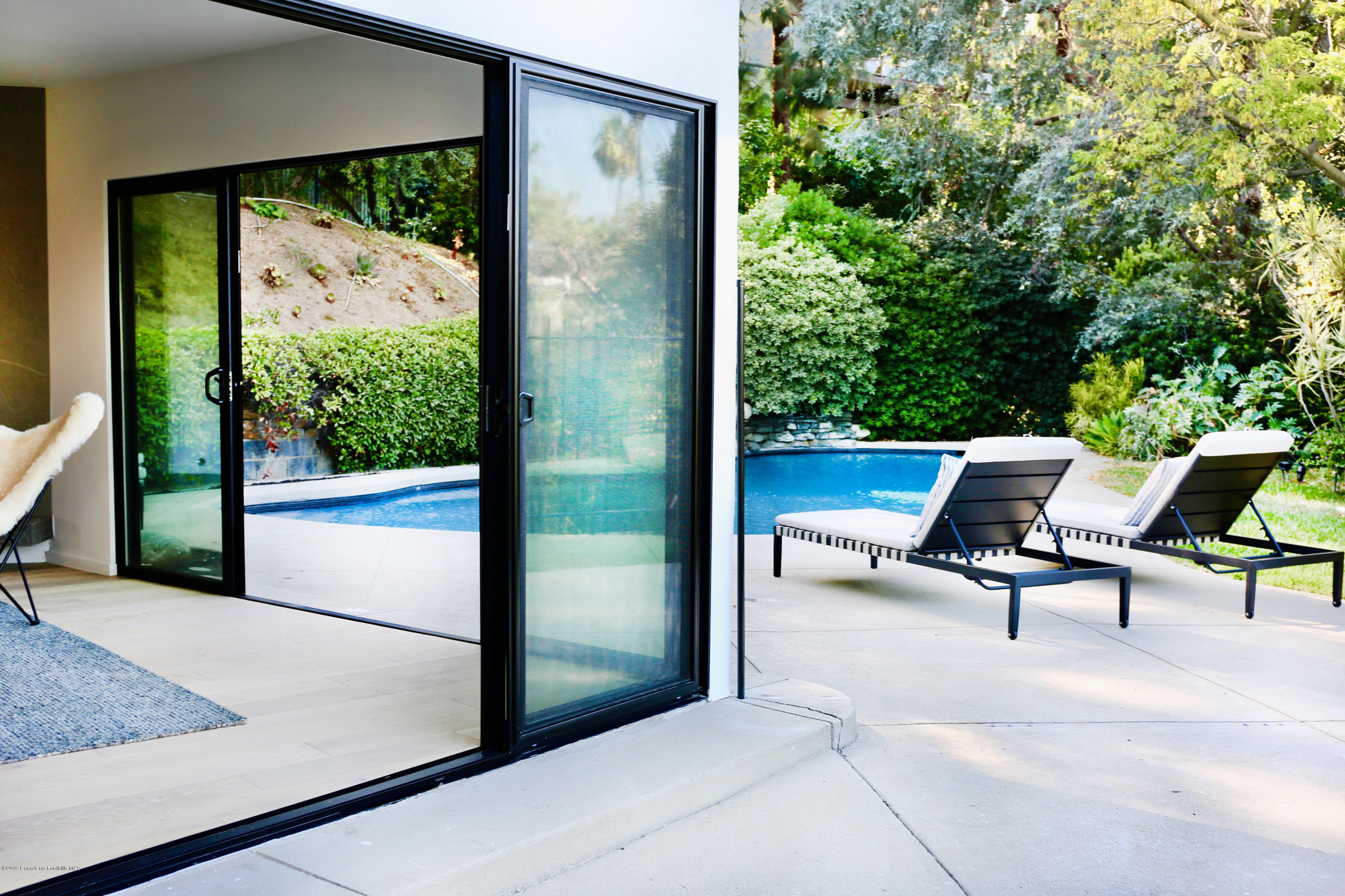 250 La Mirada Road Pasadena, CA 91105 - Photo 21 of 42 a view of a two chairs in the balcony