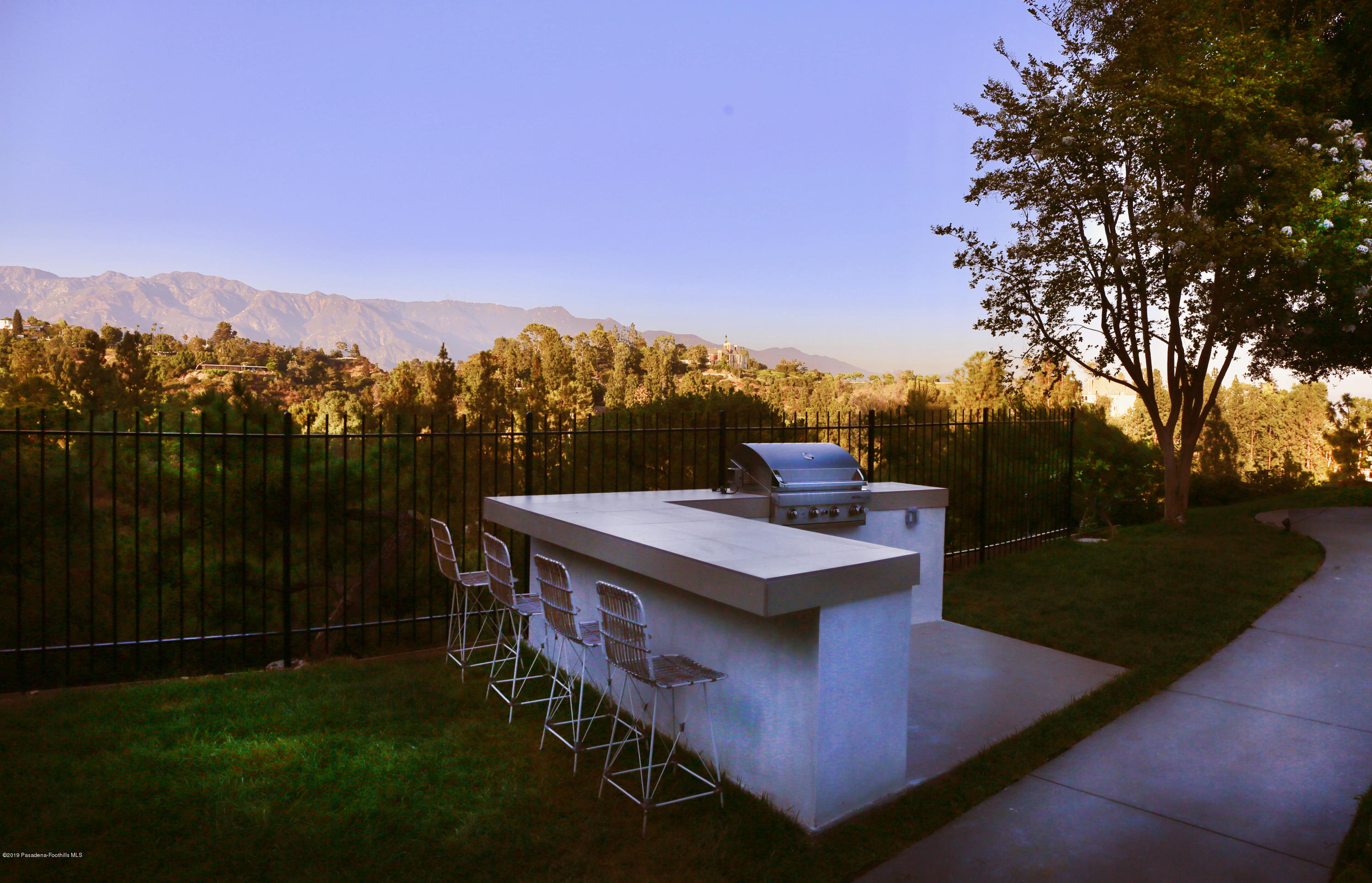 250 La Mirada Road Pasadena, CA 91105 - Photo 23 of 42 a view of a terrace with a yard