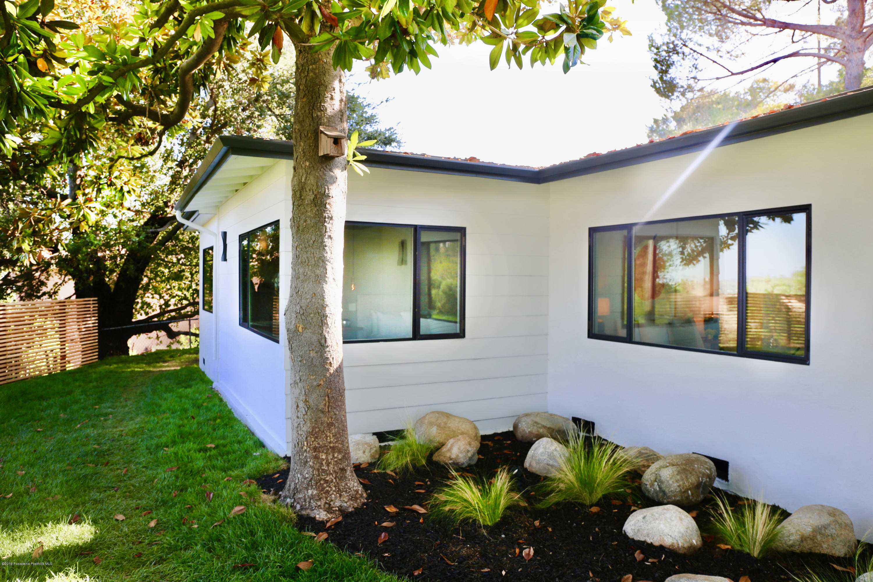250 La Mirada Road Pasadena, CA 91105 - Photo 27 of 42 a front view of a house with a yard