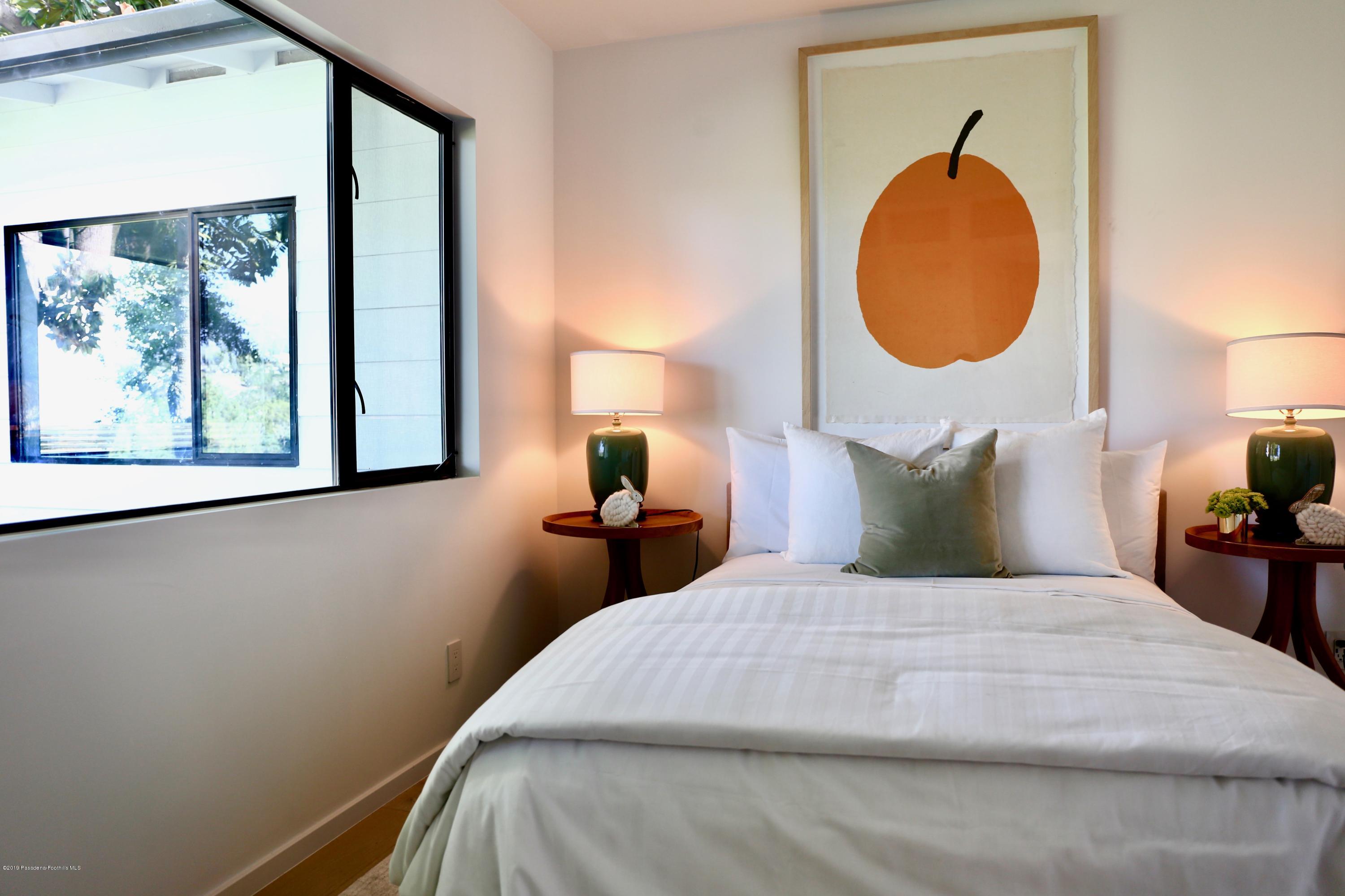 250 La Mirada Road Pasadena, CA 91105 - Photo 33 of 42 a bedroom with a bed and a window