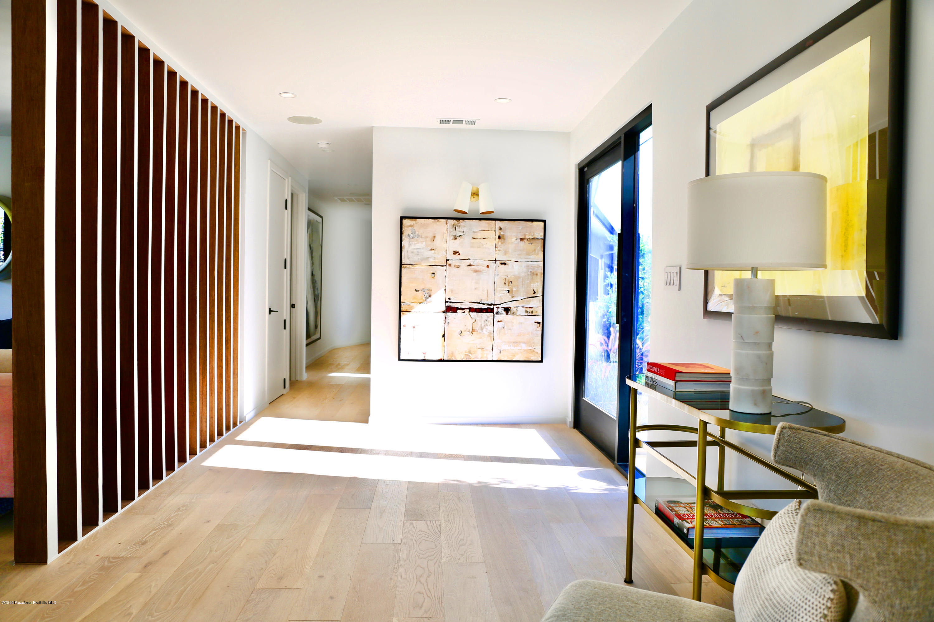 250 La Mirada Road Pasadena, CA 91105 - Photo 6 of 42 a view of a living room couch and a window
