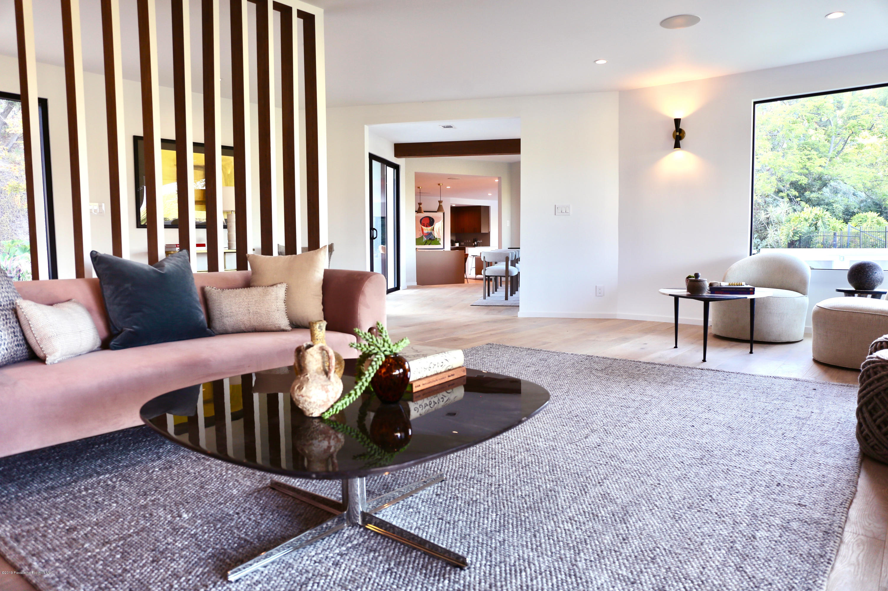 250 La Mirada Road Pasadena, CA 91105 - Photo 8 of 42 a living room with furniture and a large window