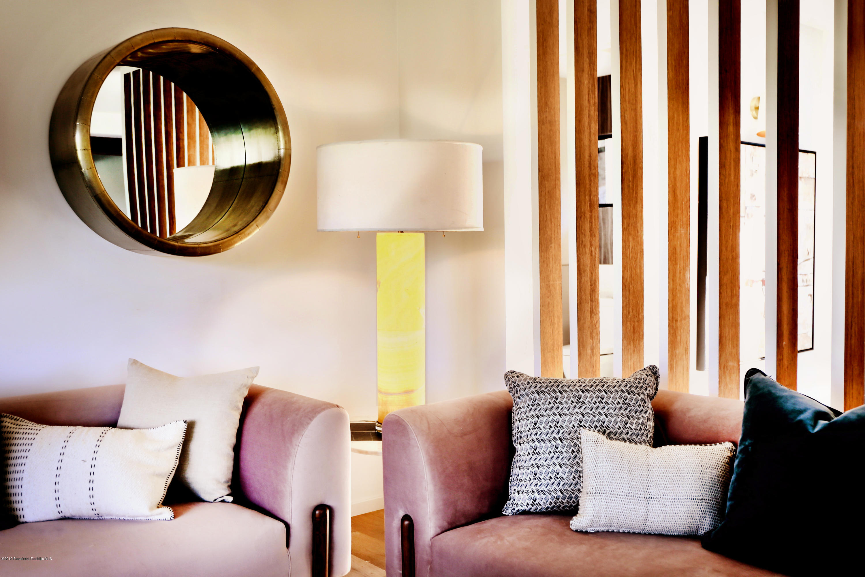 250 La Mirada Road Pasadena, CA 91105 - Photo 9 of 42 a living room with a couch and a large mirror