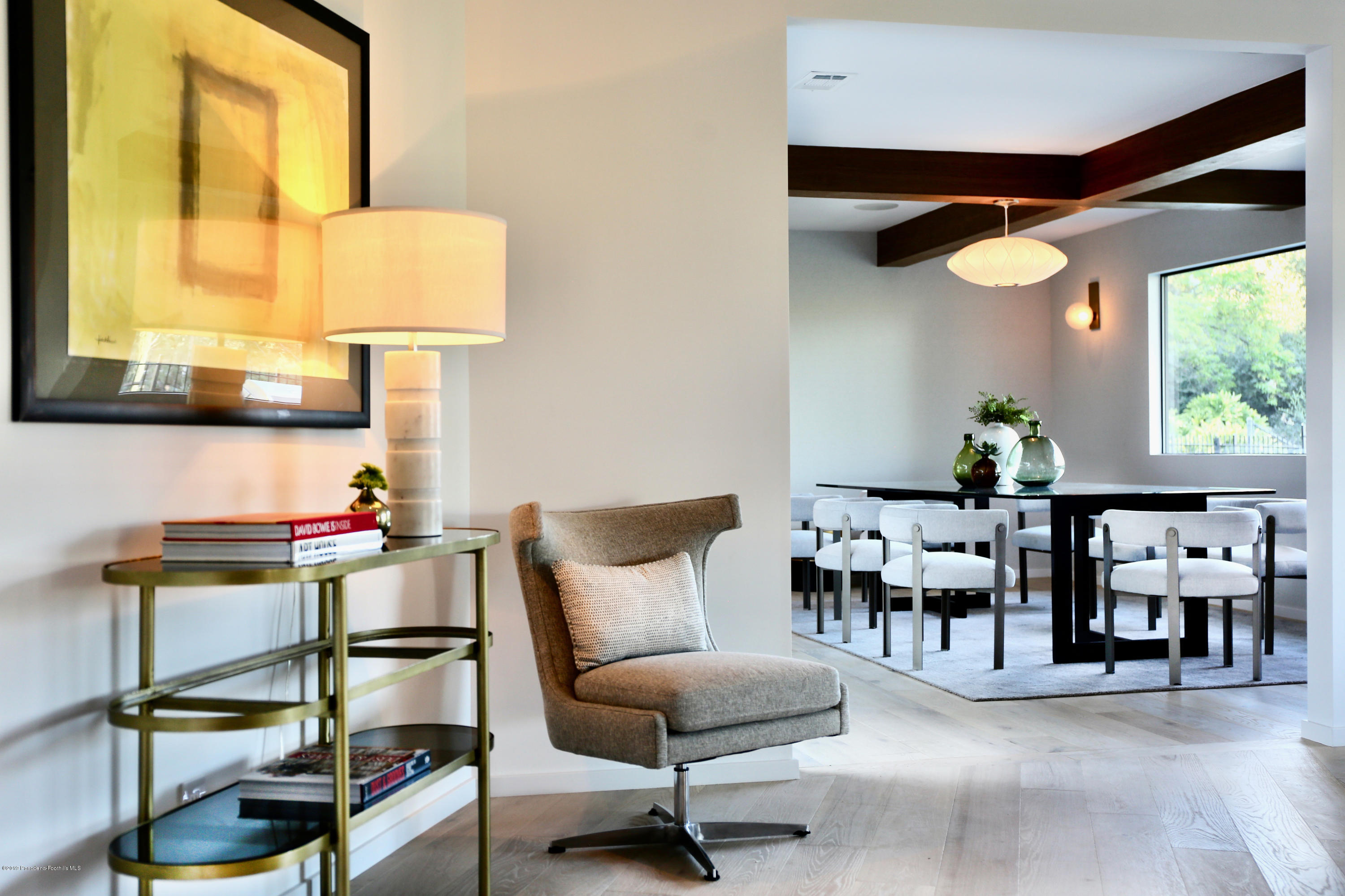 250 La Mirada Road Pasadena, CA 91105 - Photo 10 of 42 a dining room with furniture and wooden floor