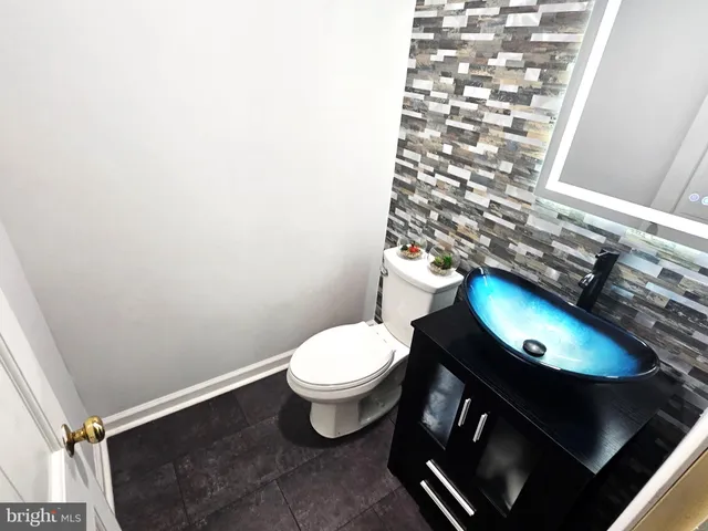 a bathroom with a toilet and a sink
