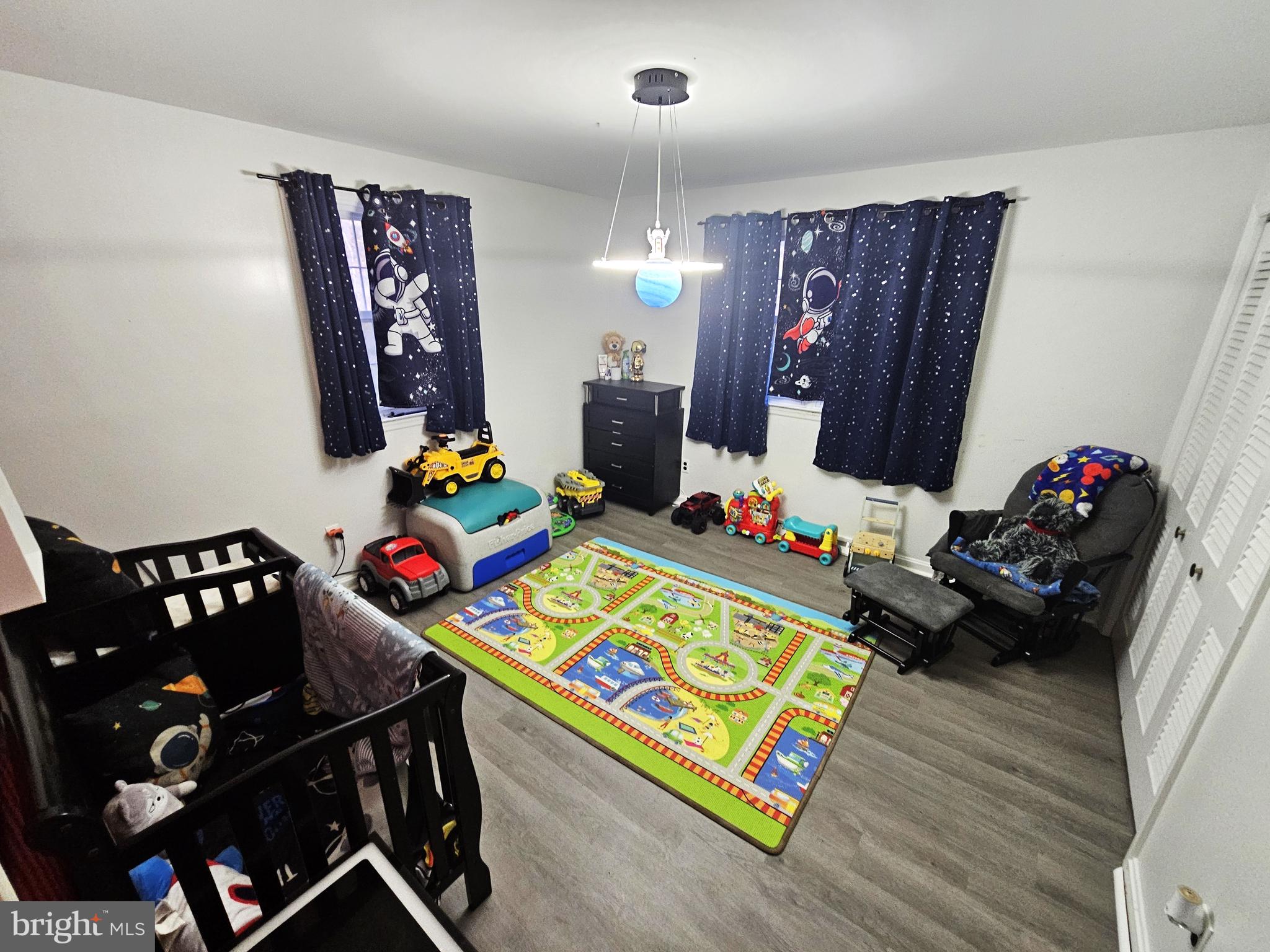 757 Auburn Mill Road Hockessin, DE 19707 - Photo 9 of 10 a bedroom with a bed and wooden floor