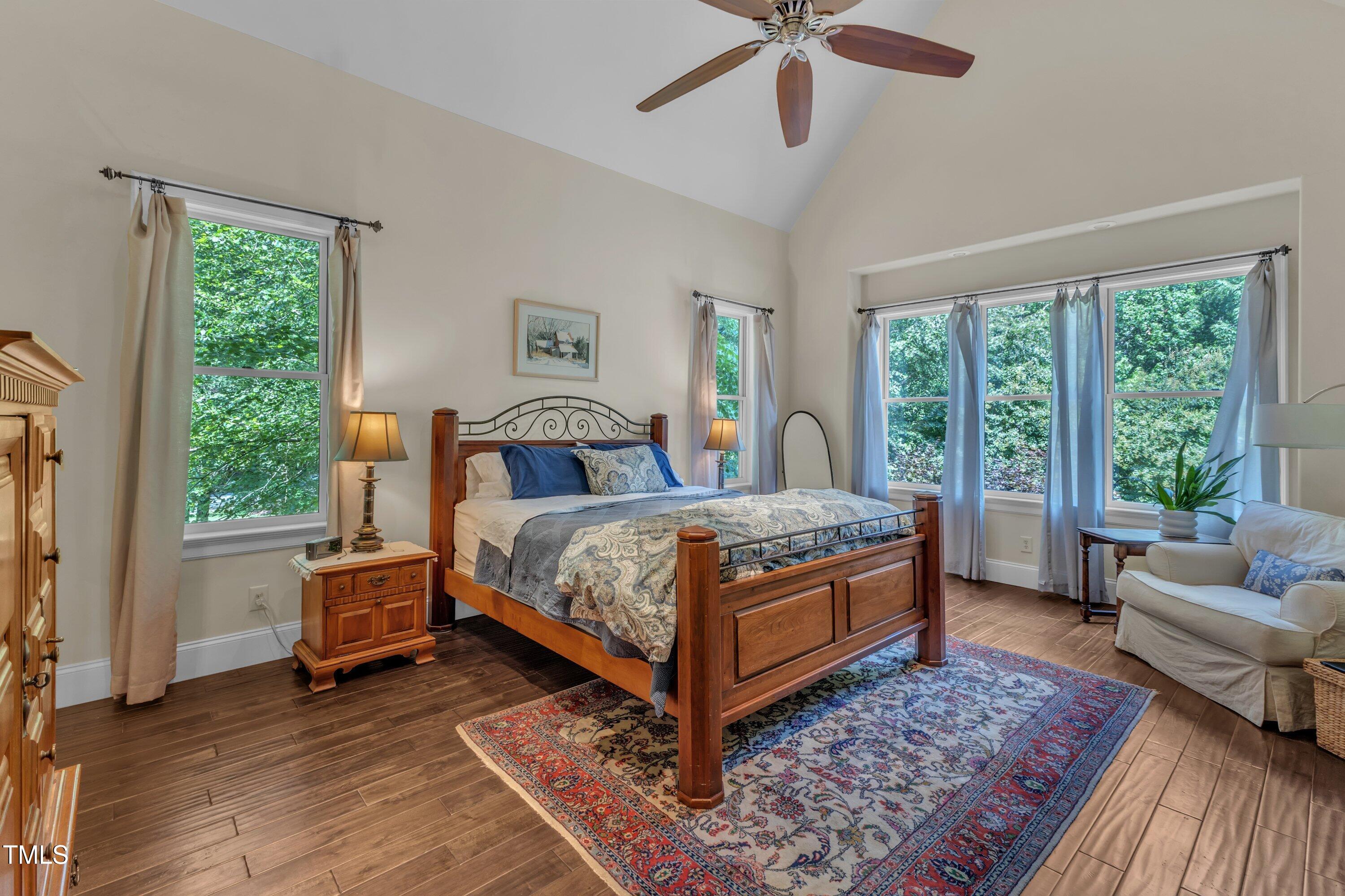 1004 Tobiano Lane Raleigh, NC 27614 - Photo 18 of 48 a bedroom with a bed and a couch