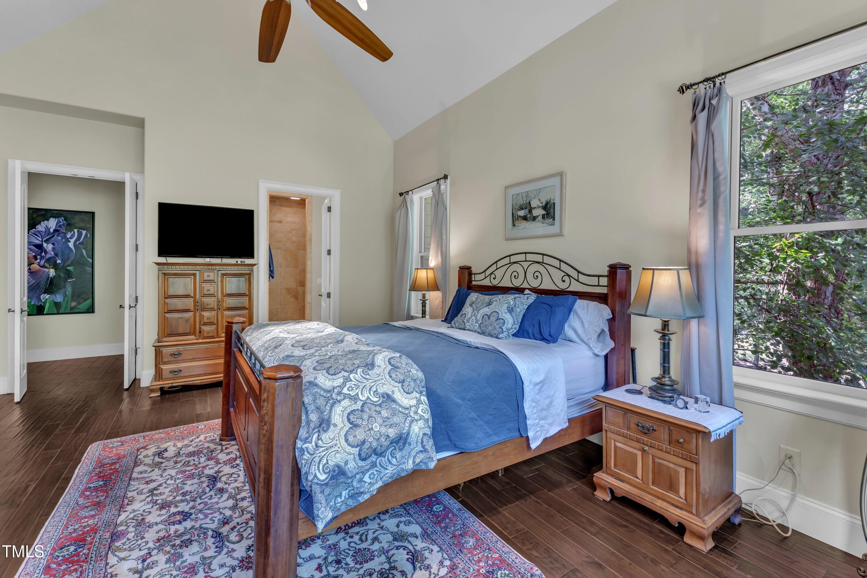 1004 Tobiano Lane Raleigh, NC 27614 - Photo 19 of 48 a bedroom with a bed and wooden floor