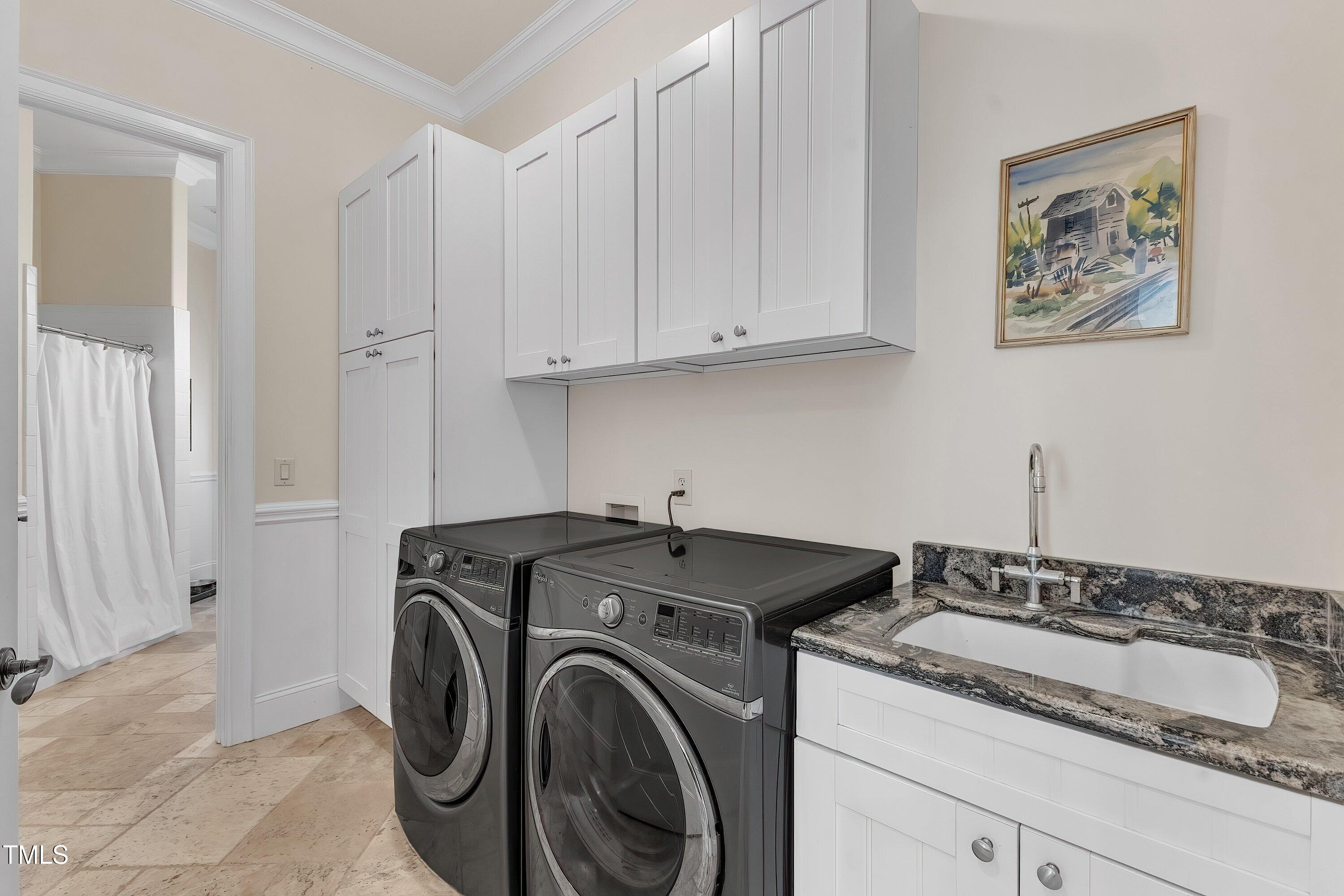 1004 Tobiano Lane Raleigh, NC 27614 - Photo 26 of 48 a utility room with sink dryer and washer