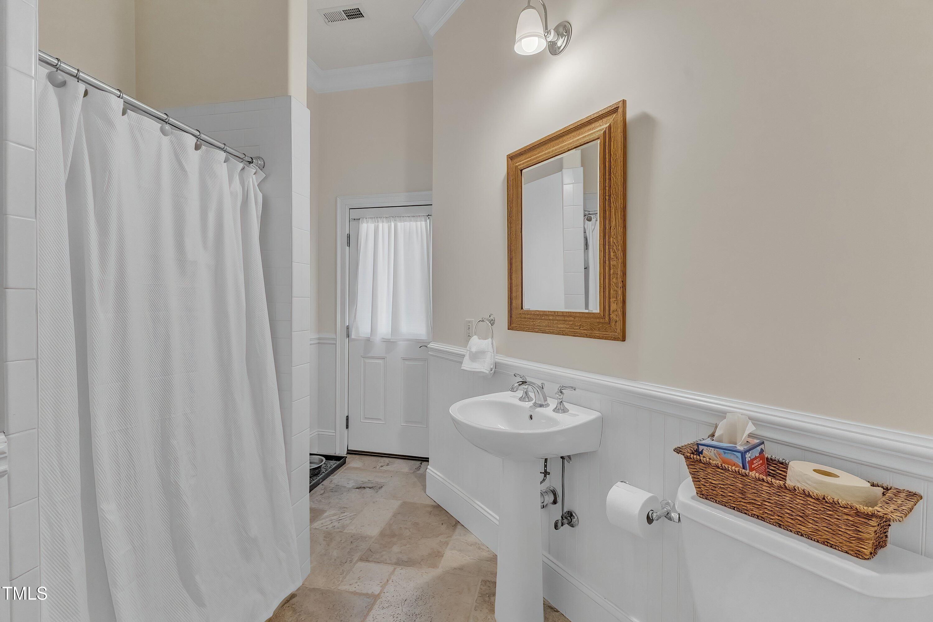 1004 Tobiano Lane Raleigh, NC 27614 - Photo 27 of 48 a bathroom with a sink toilet and tub