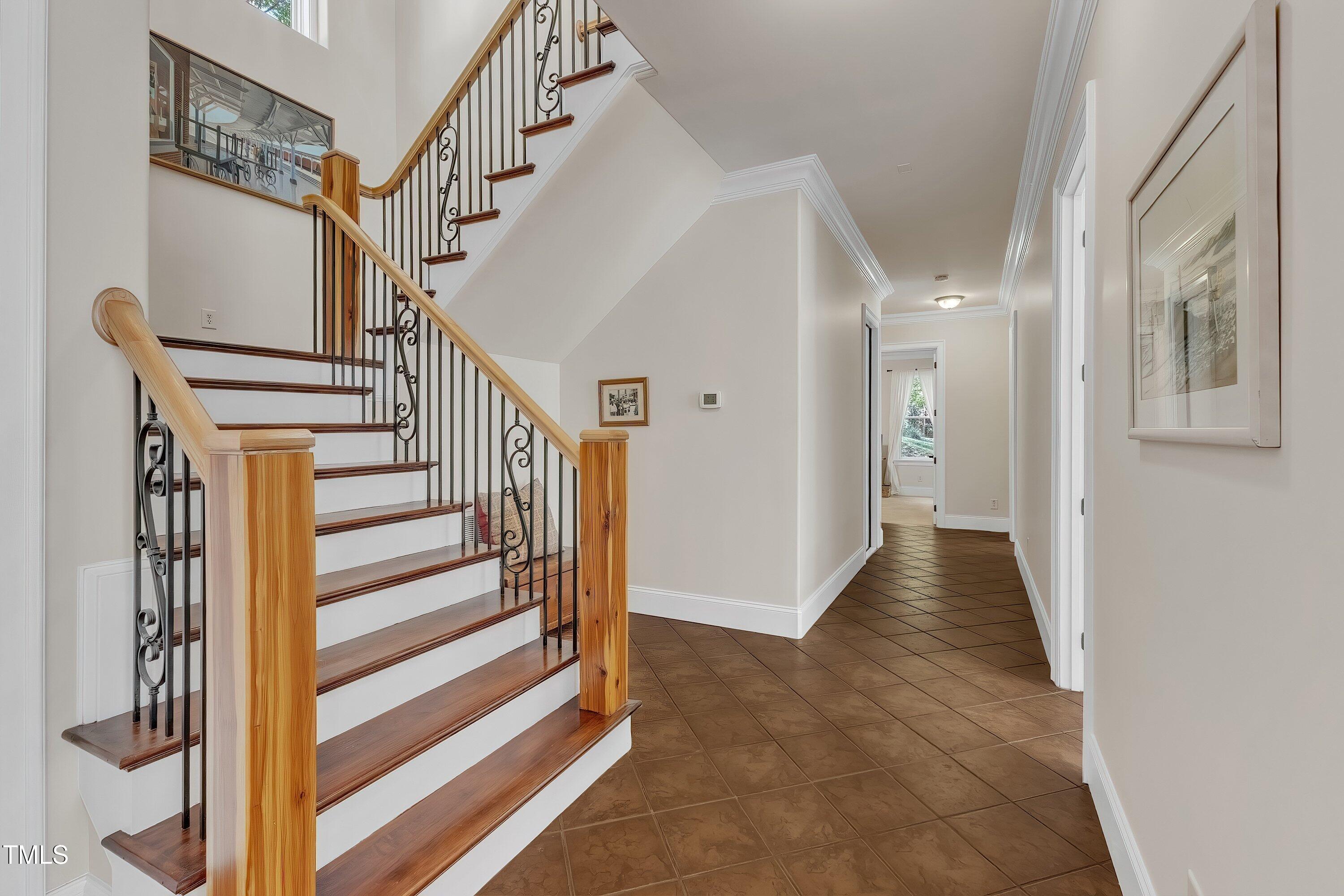 1004 Tobiano Lane Raleigh, NC 27614 - Photo 28 of 48 a view of a hallway with wooden floor and entryway