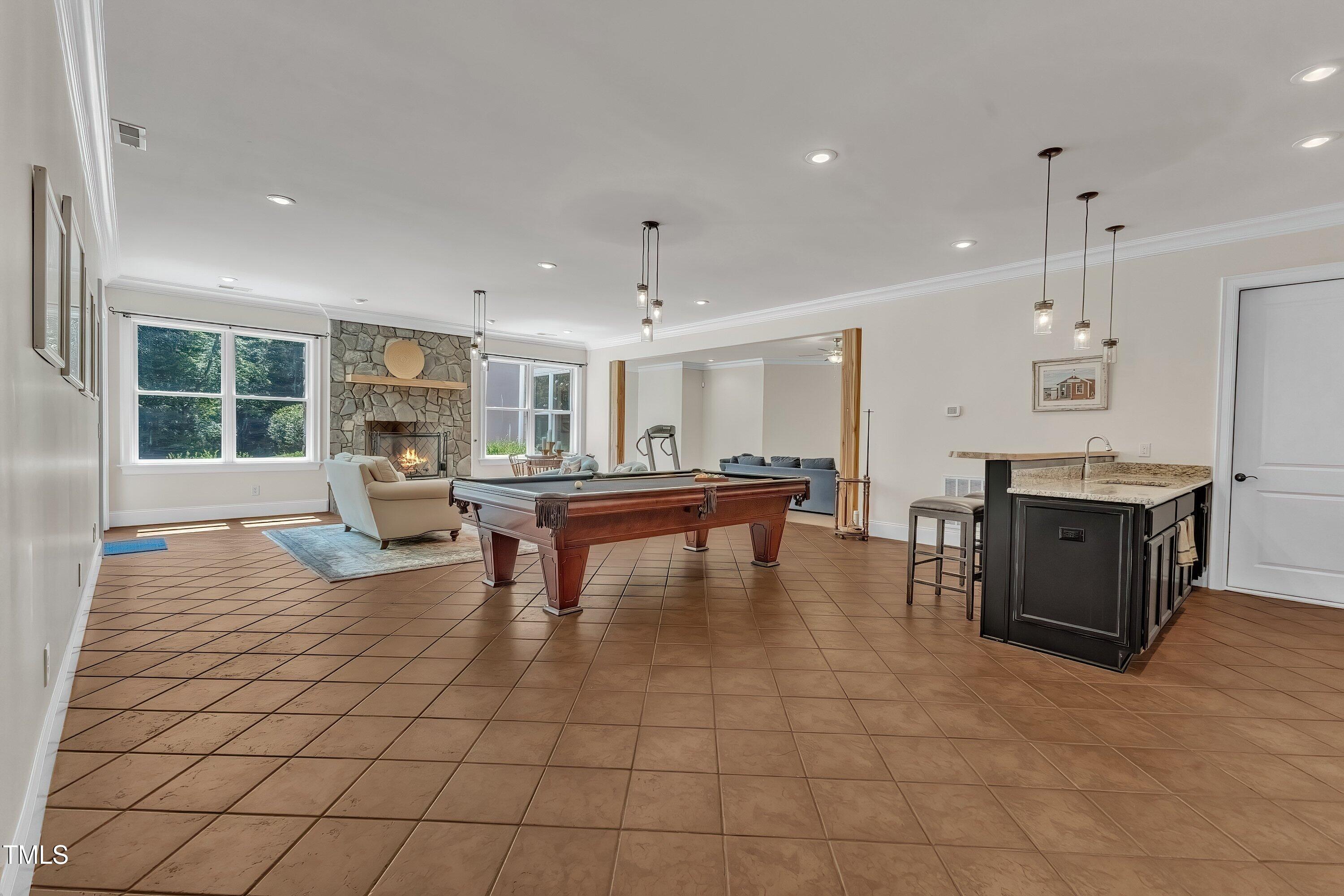 1004 Tobiano Lane Raleigh, NC 27614 - Photo 30 of 48 a living room with furniture a table and kitchen view