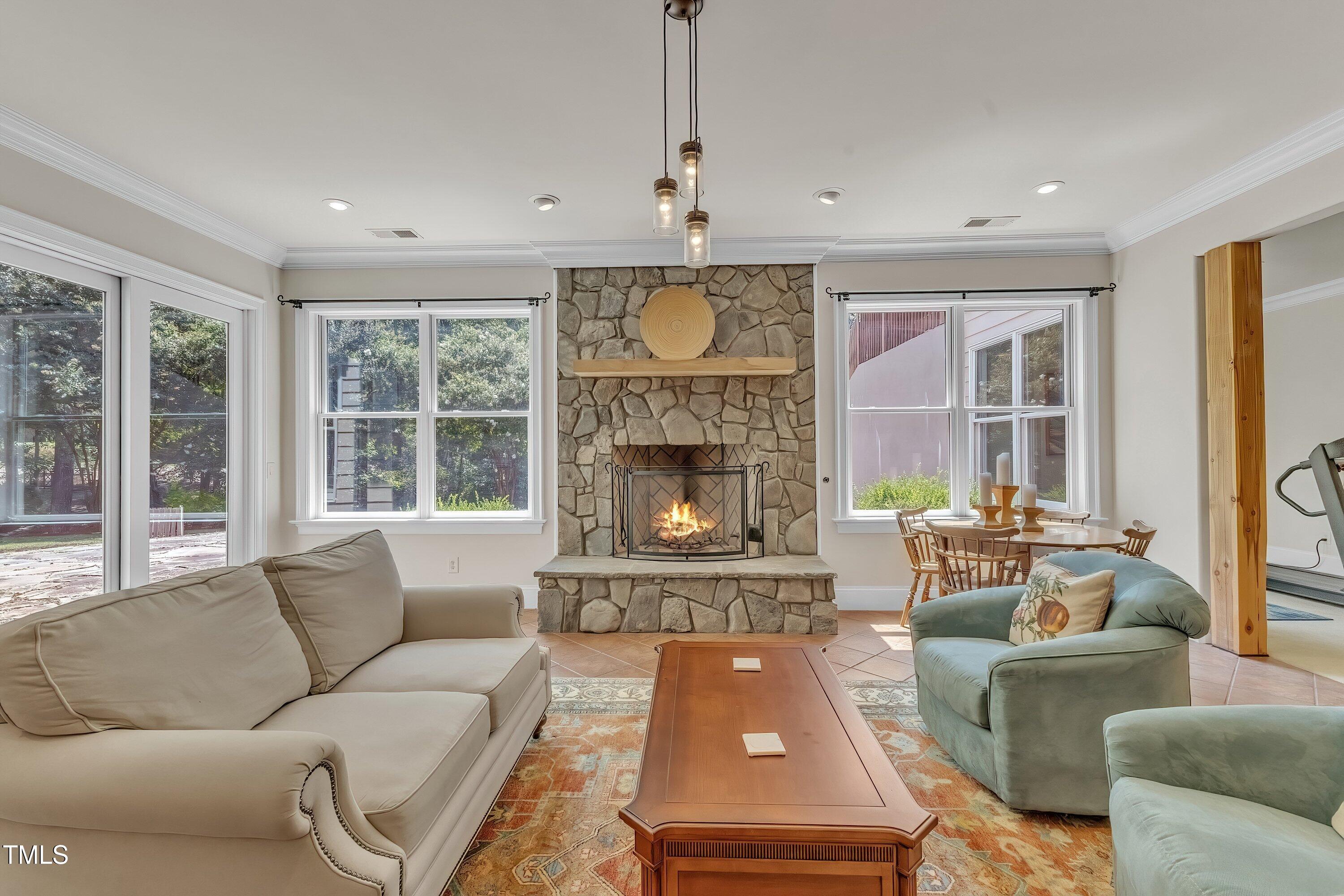 1004 Tobiano Lane Raleigh, NC 27614 - Photo 31 of 48 a living room with furniture fireplace and large windows