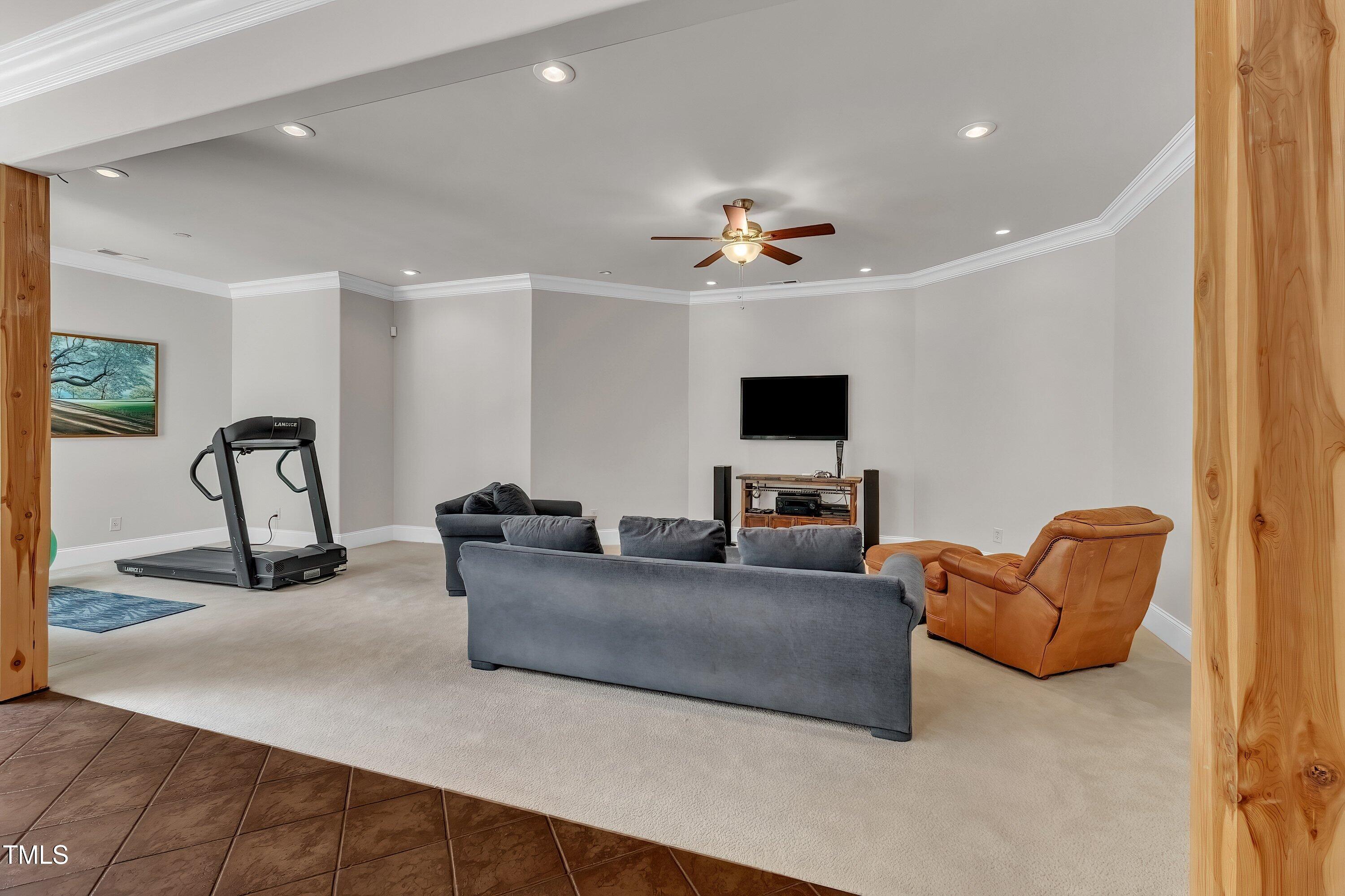 1004 Tobiano Lane Raleigh, NC 27614 - Photo 32 of 48 a living room with furniture and a flat screen tv