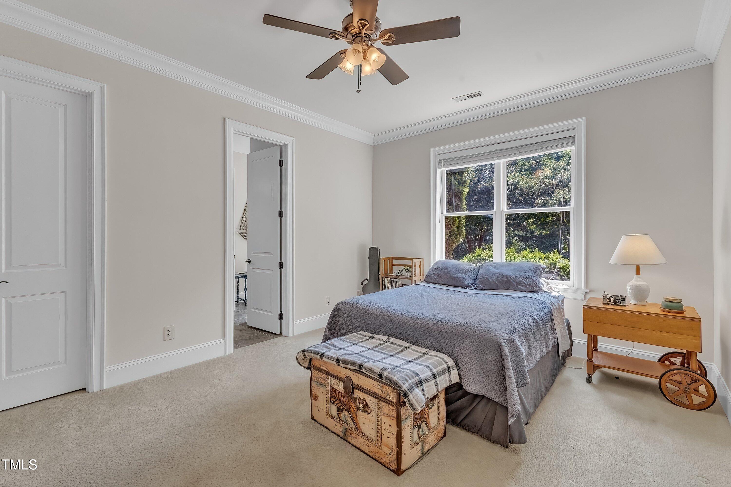 1004 Tobiano Lane Raleigh, NC 27614 - Photo 34 of 48 a bedroom with a bed dresser and a window