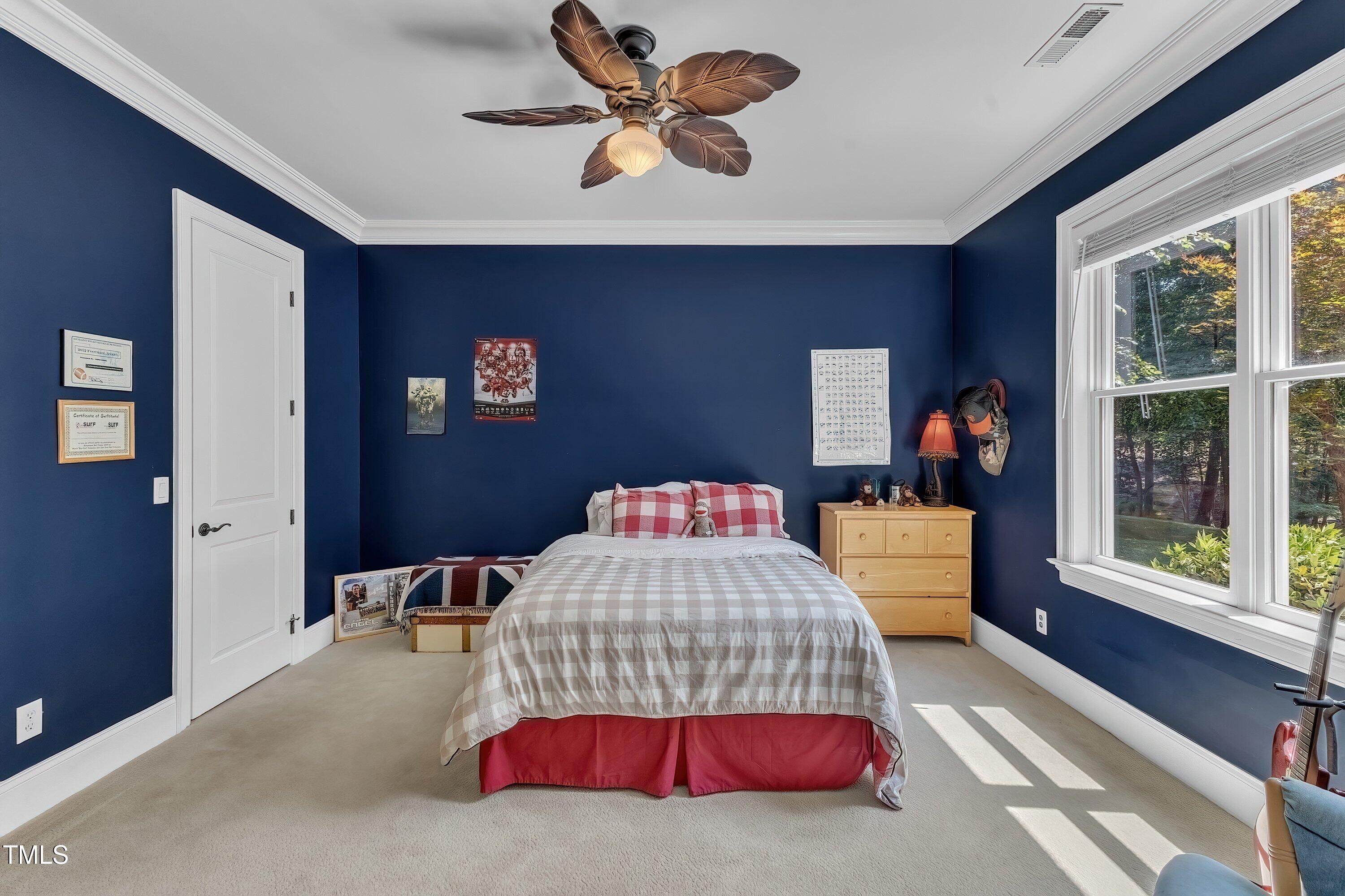 1004 Tobiano Lane Raleigh, NC 27614 - Photo 35 of 48 a bedroom with a bed and a large window
