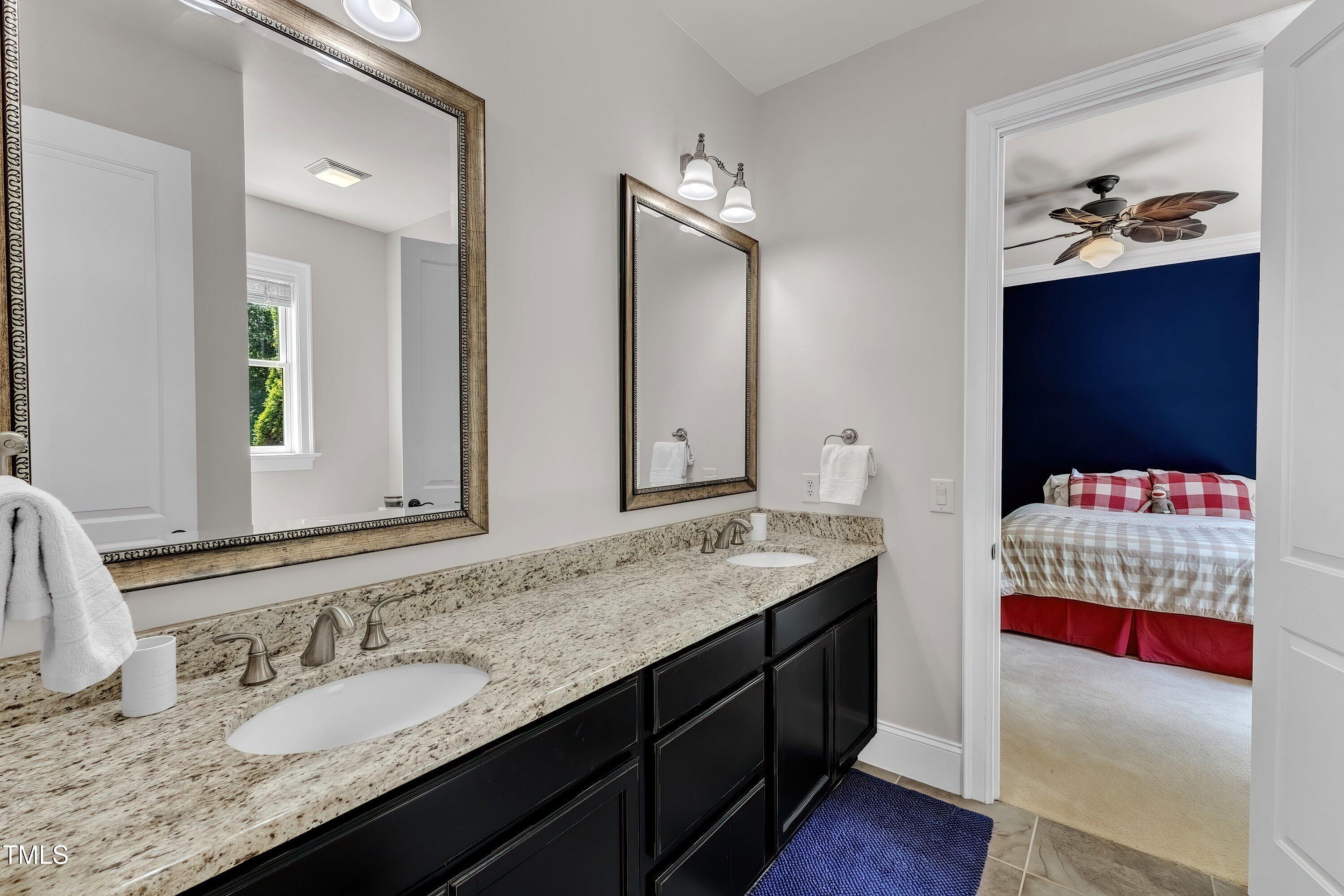 1004 Tobiano Lane Raleigh, NC 27614 - Photo 36 of 48 a bathroom with a sink double vanity and a mirror