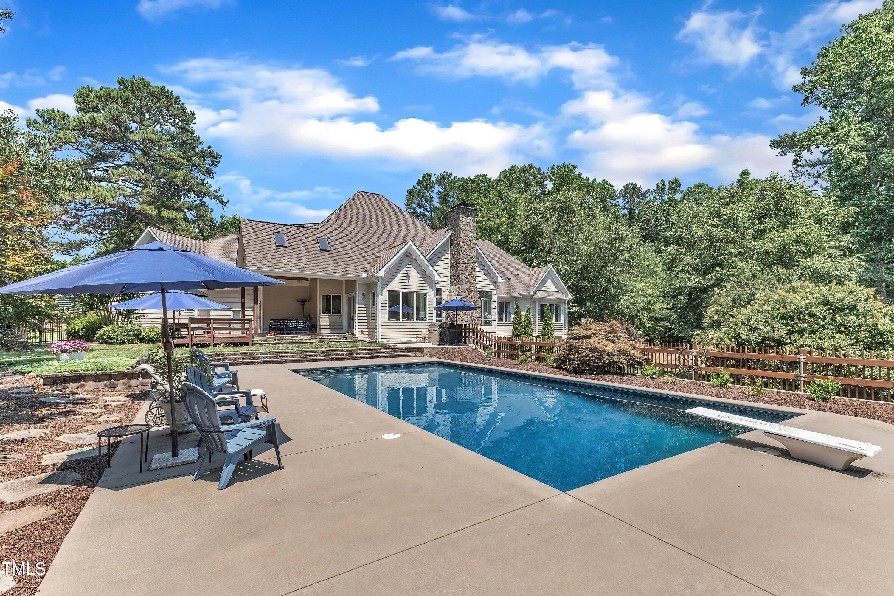 1004 Tobiano Lane Raleigh, NC 27614 - Photo 42 of 48 a view of a house with swimming pool and sitting area