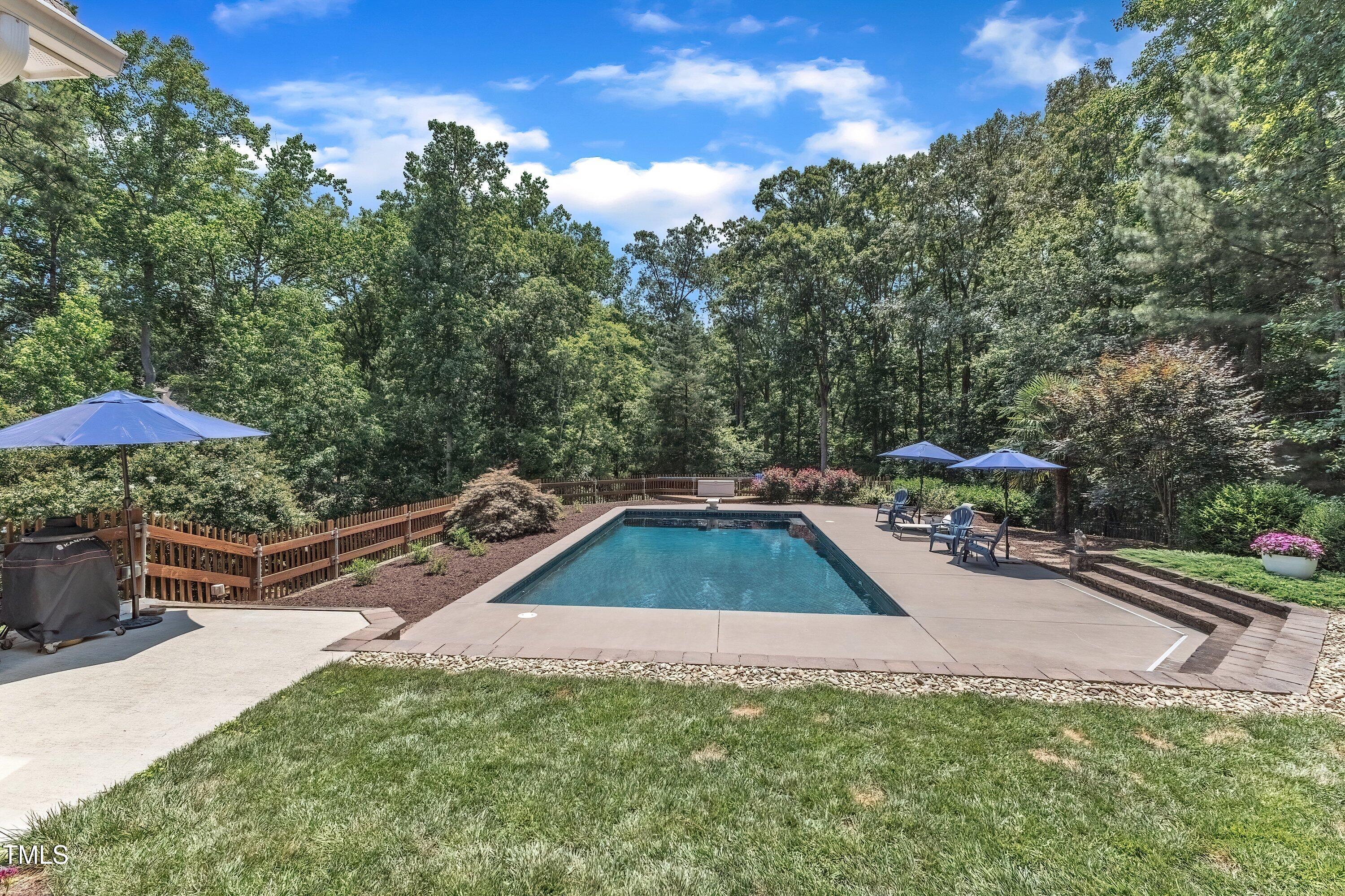 1004 Tobiano Lane Raleigh, NC 27614 - Photo 43 of 48 a view of a backyard with swimming pool