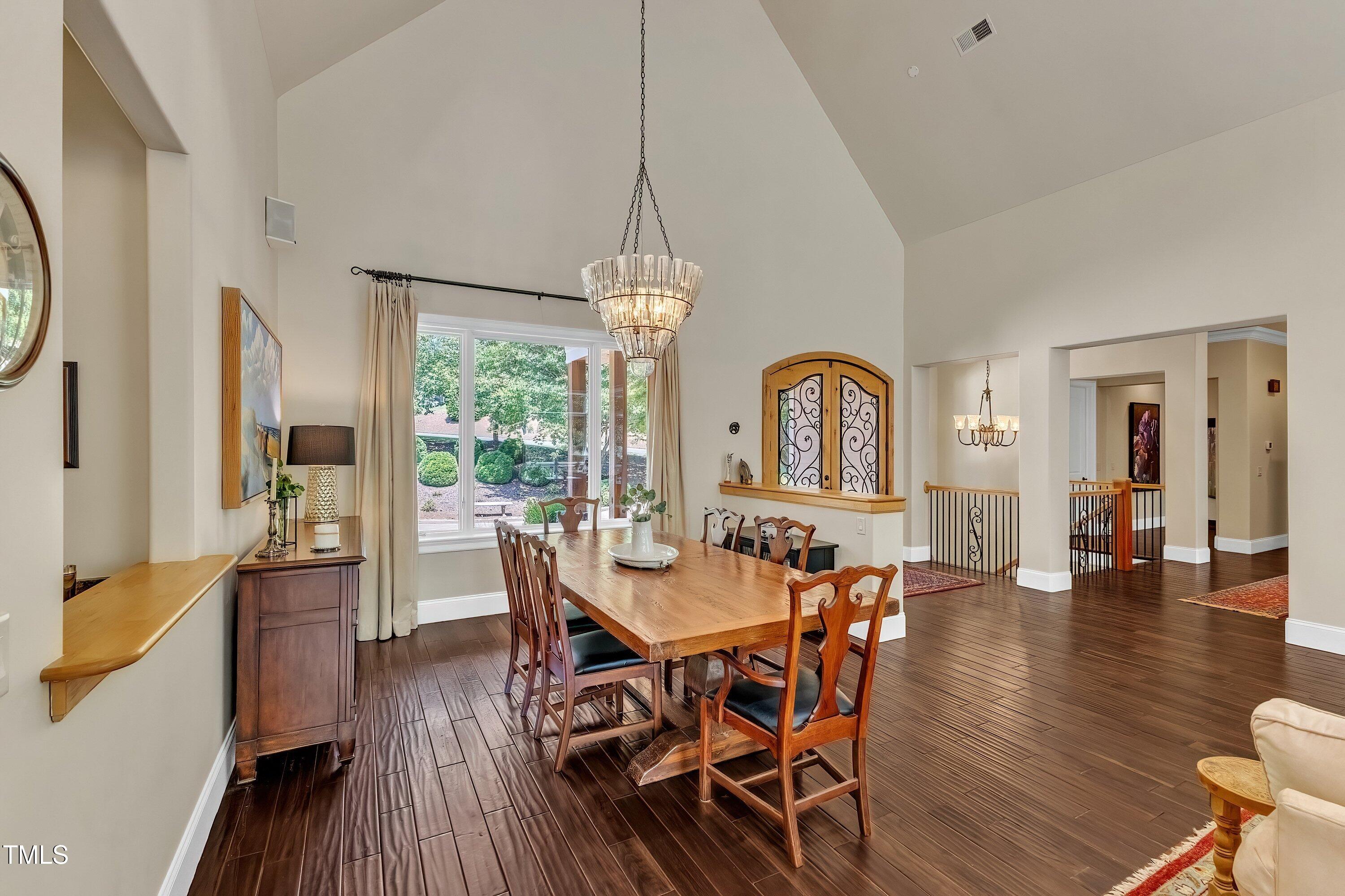 1004 Tobiano Lane Raleigh, NC 27614 - Photo 6 of 48 a view of a dining room with furniture window and wooden floor