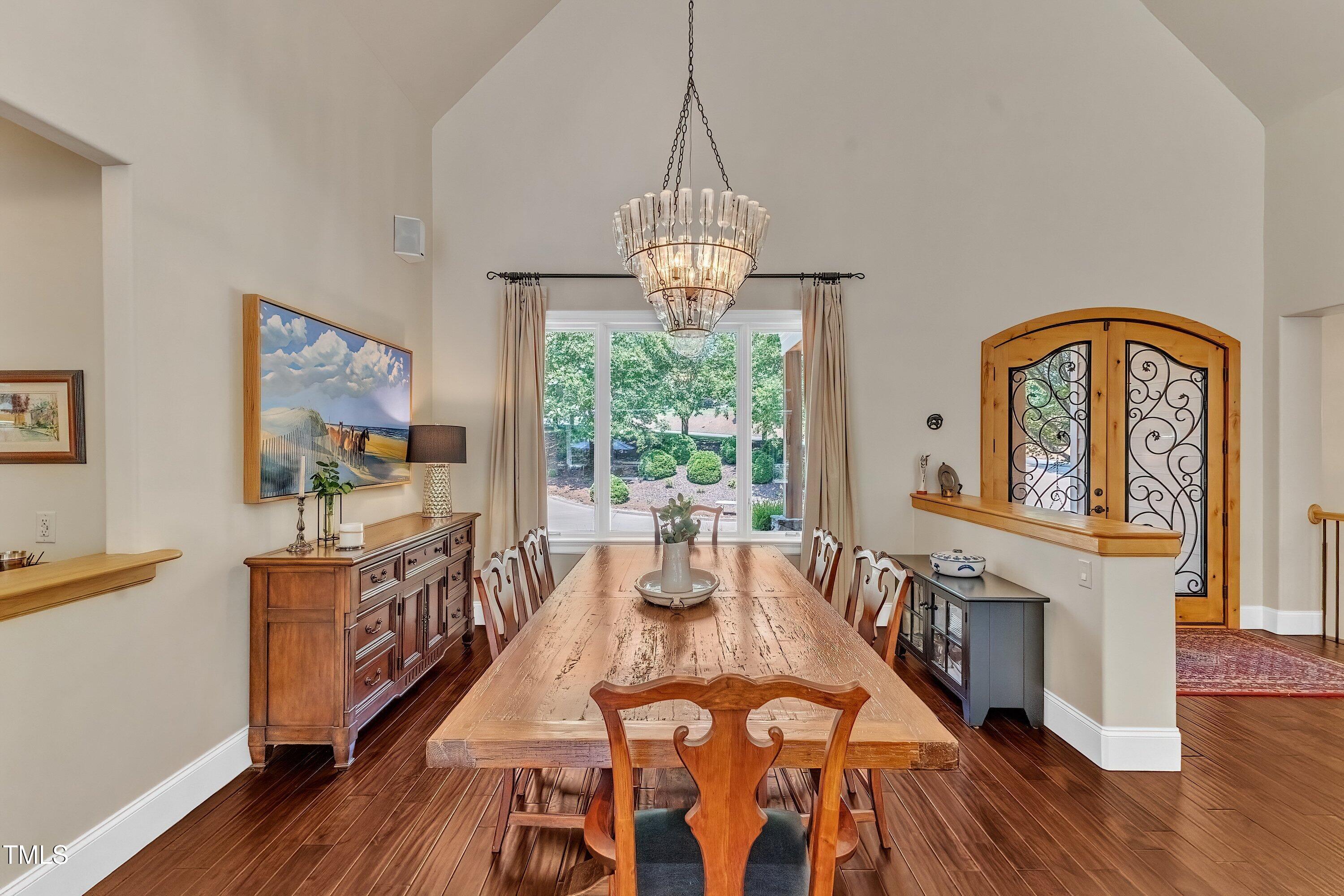 1004 Tobiano Lane Raleigh, NC 27614 - Photo 7 of 48 a view of a dining room with furniture window and wooden floor